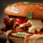 close-up of vegan cheesesteak sandwich on a cutting board