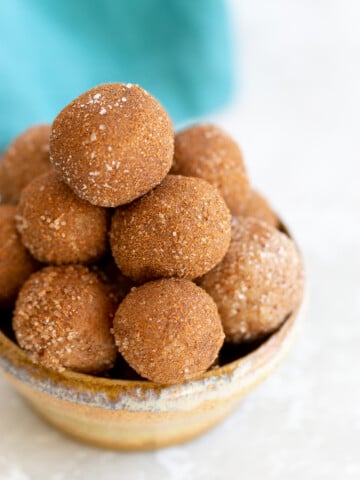 Vegan Snickerdoodle Energy Bites in a small clay bowl