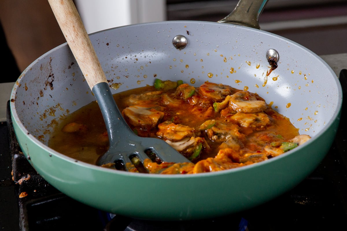 dissolving the miso into some broth with the mushroom mixture