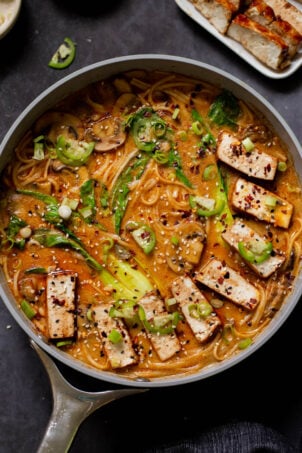 vegan tonkotsu in the pan after adding tofu and toppings