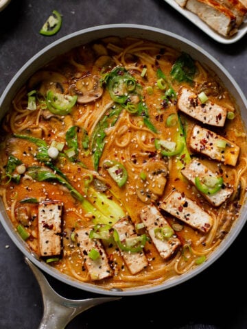 vegan tonkotsu in the pan after adding tofu and toppings