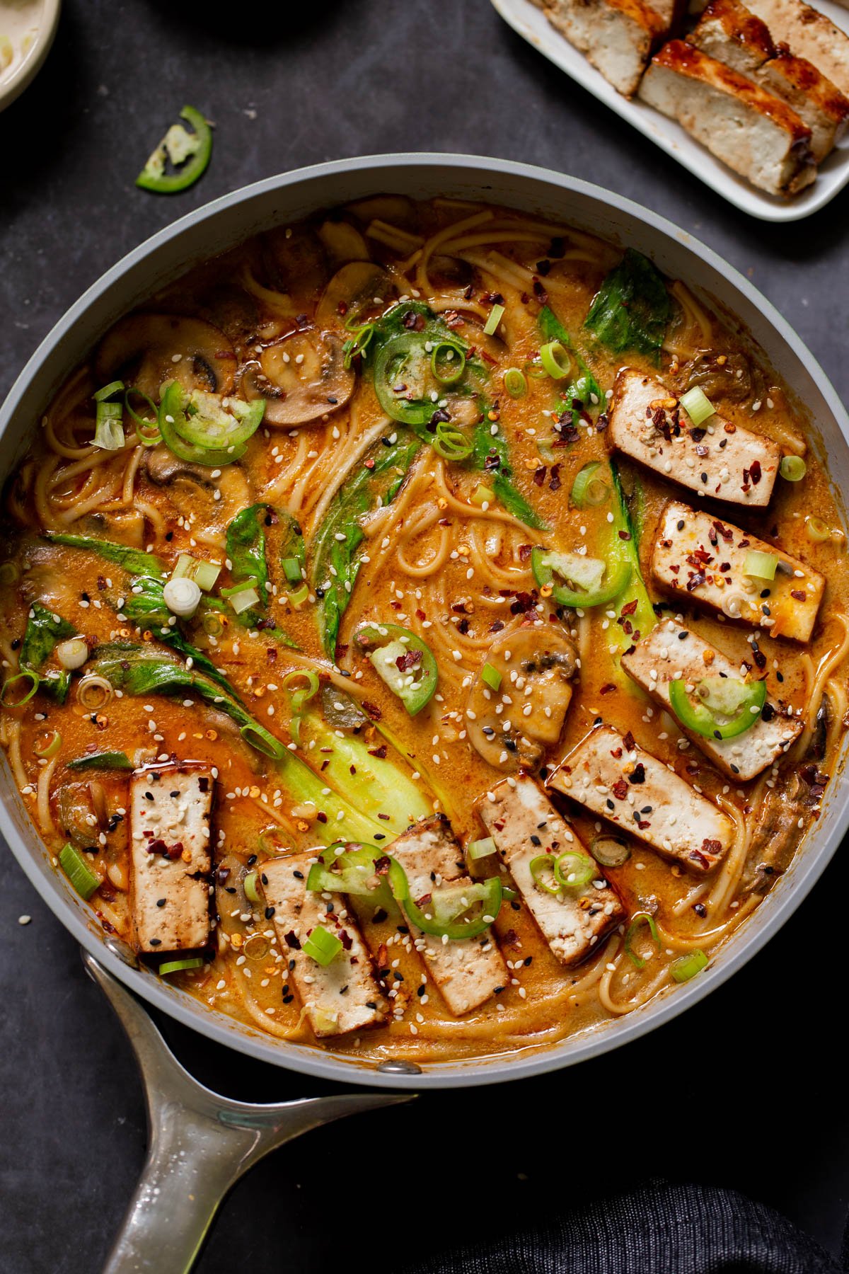 vegan tonkotsu in the pan after adding tofu and toppings