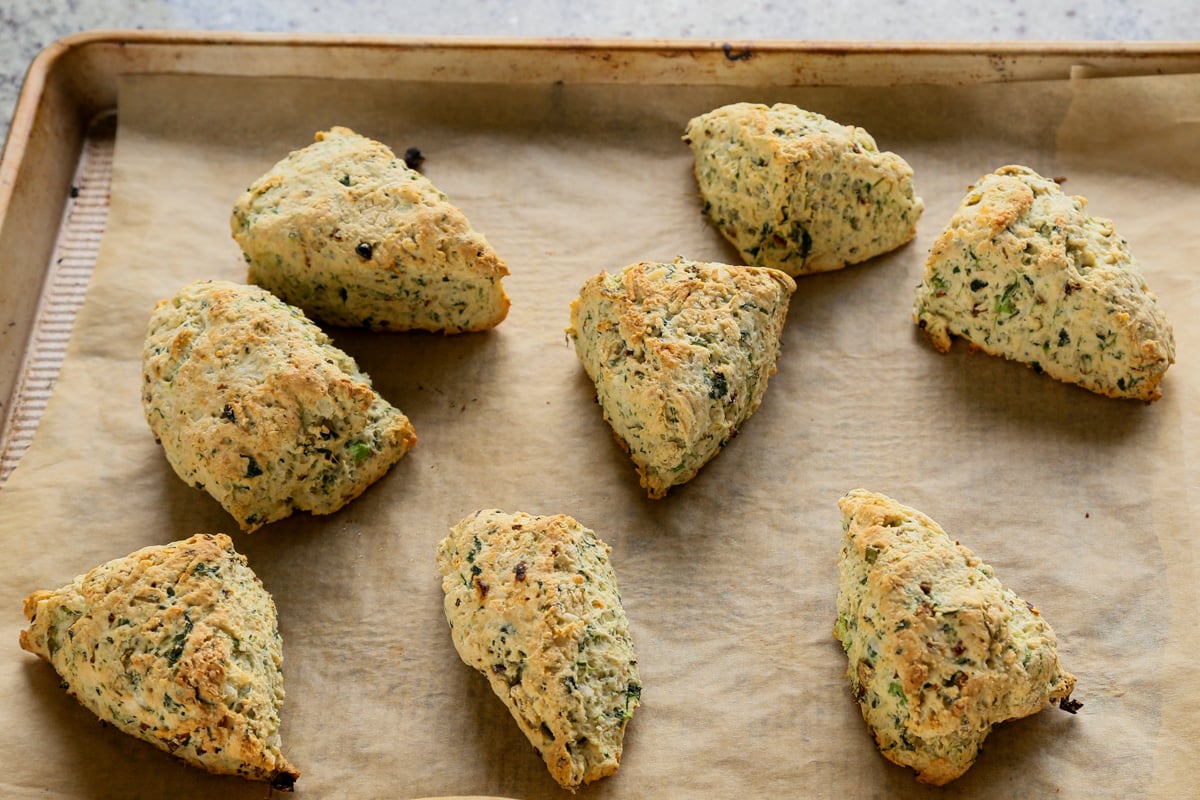 spinach and cheese scones on the baking sheet after baking