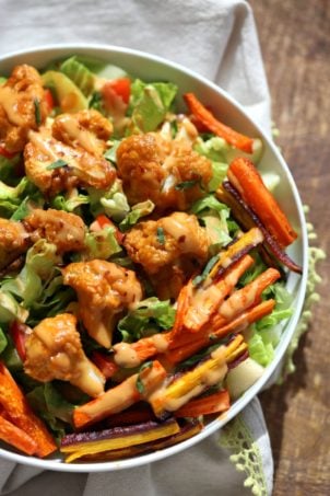 Peanut Butter Cauliflower Bowl with Roasted Carrots. Cauliflower tossed in peanut butter sauce and roasted, carrots tossed in hot sauce and roasted. Vegan Recipe, Gluten-free Recipe.  | VeganRicha.com