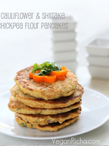 Easy Chickpea flour pancakes with grated cauliflower and shiitake mushrooms. These are fat pancakes made with a thick chickpea flour batter. Add more water for thinner batter and thinner pancakes. Makes 5 fat pancakes.