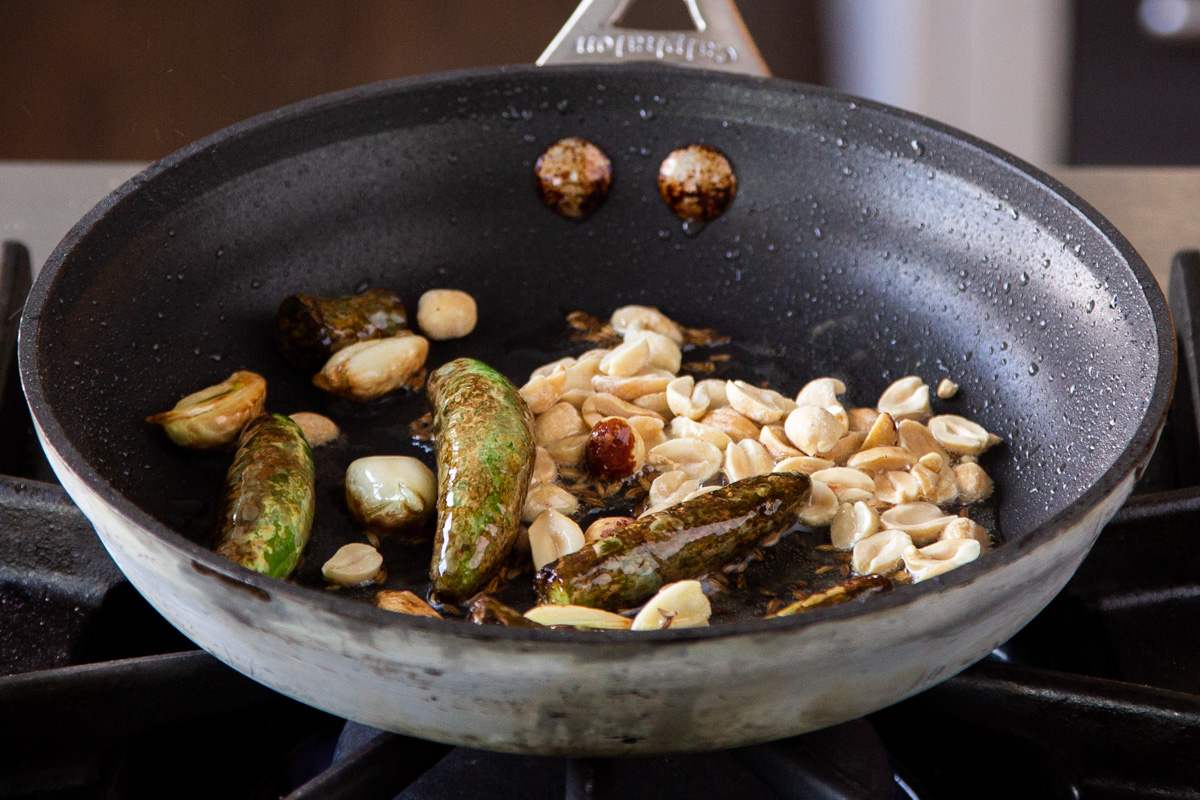 adding remaining thecha ingredients to the pan