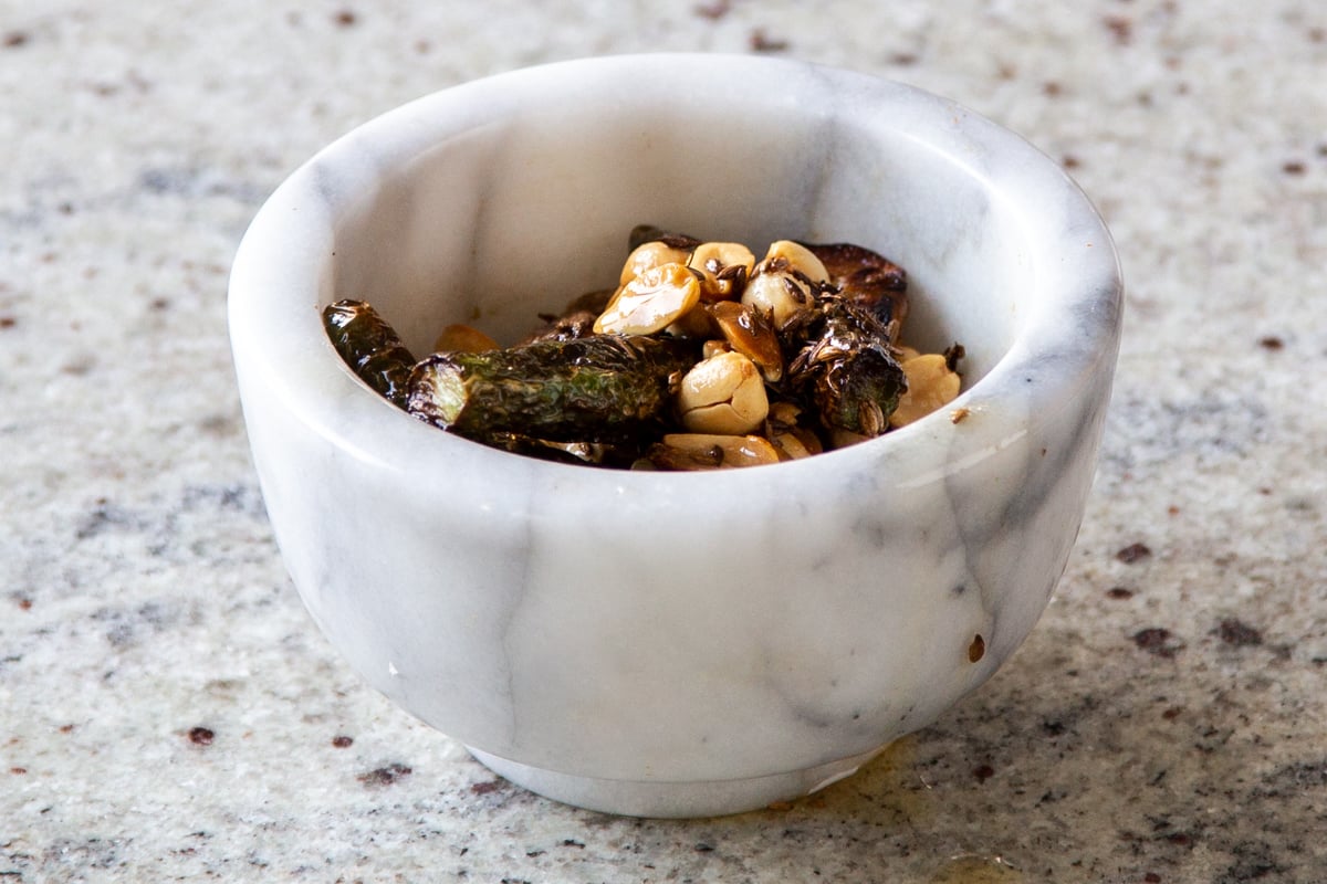 whole thecha ingredients in the mortar, before grinding