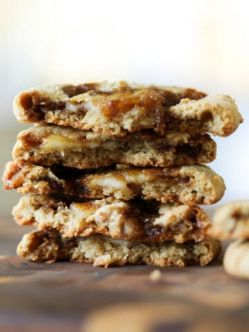 stack of halved tiramisu cookies, so you can see inside them