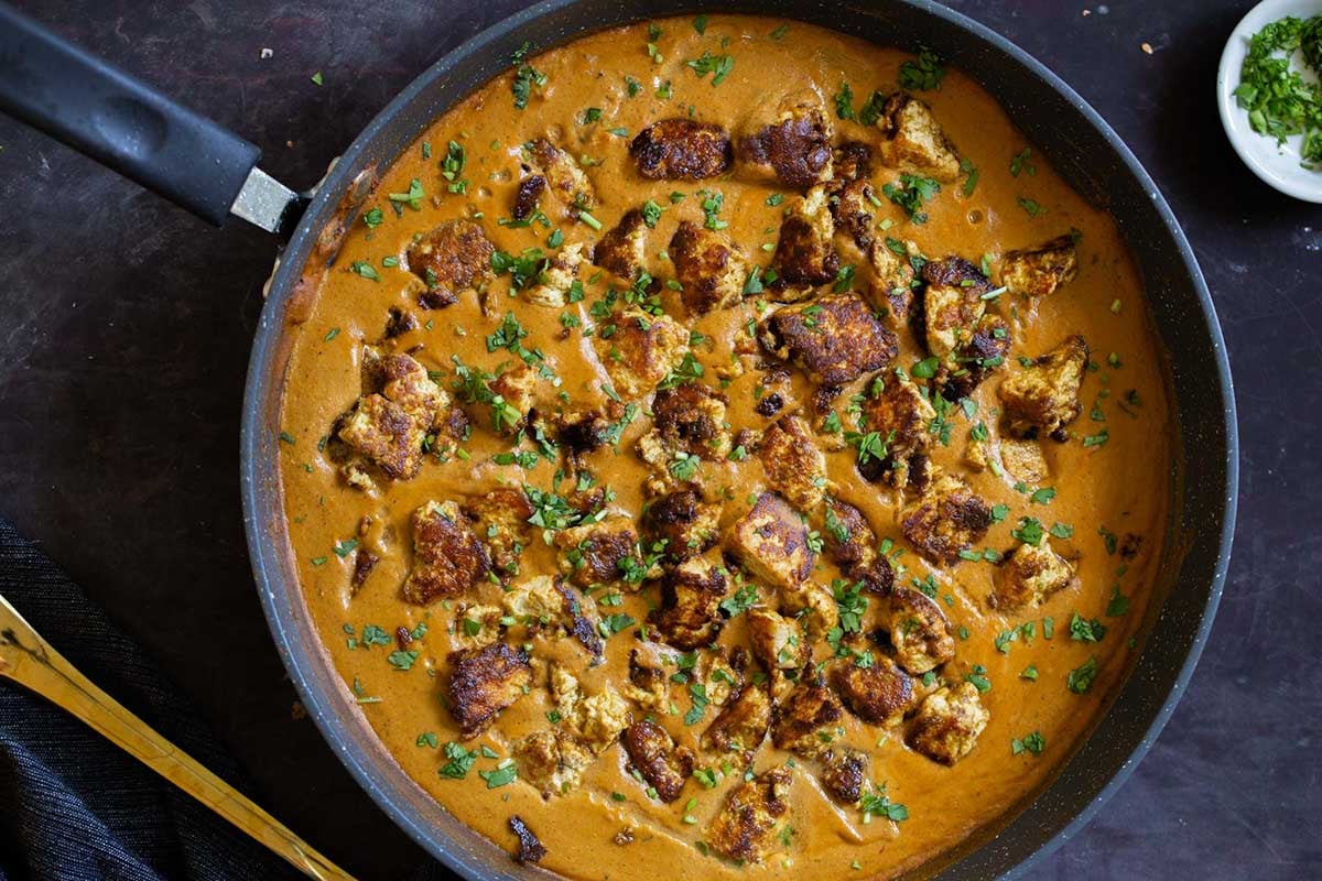 tofu barra in the pan after cooking and adding garnishes