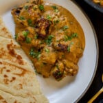tofu barra on a plate with a side of flatbread