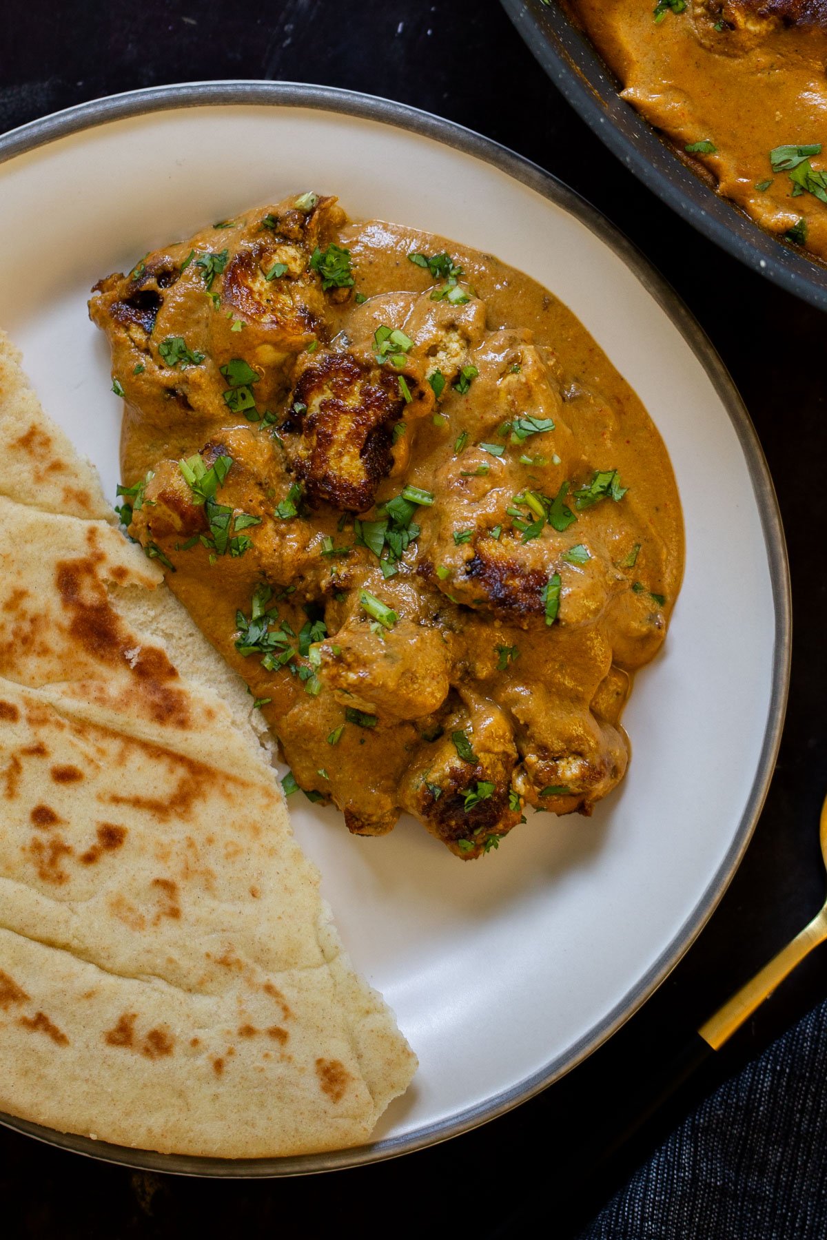 tofu barra on a plate with a side of flatbread