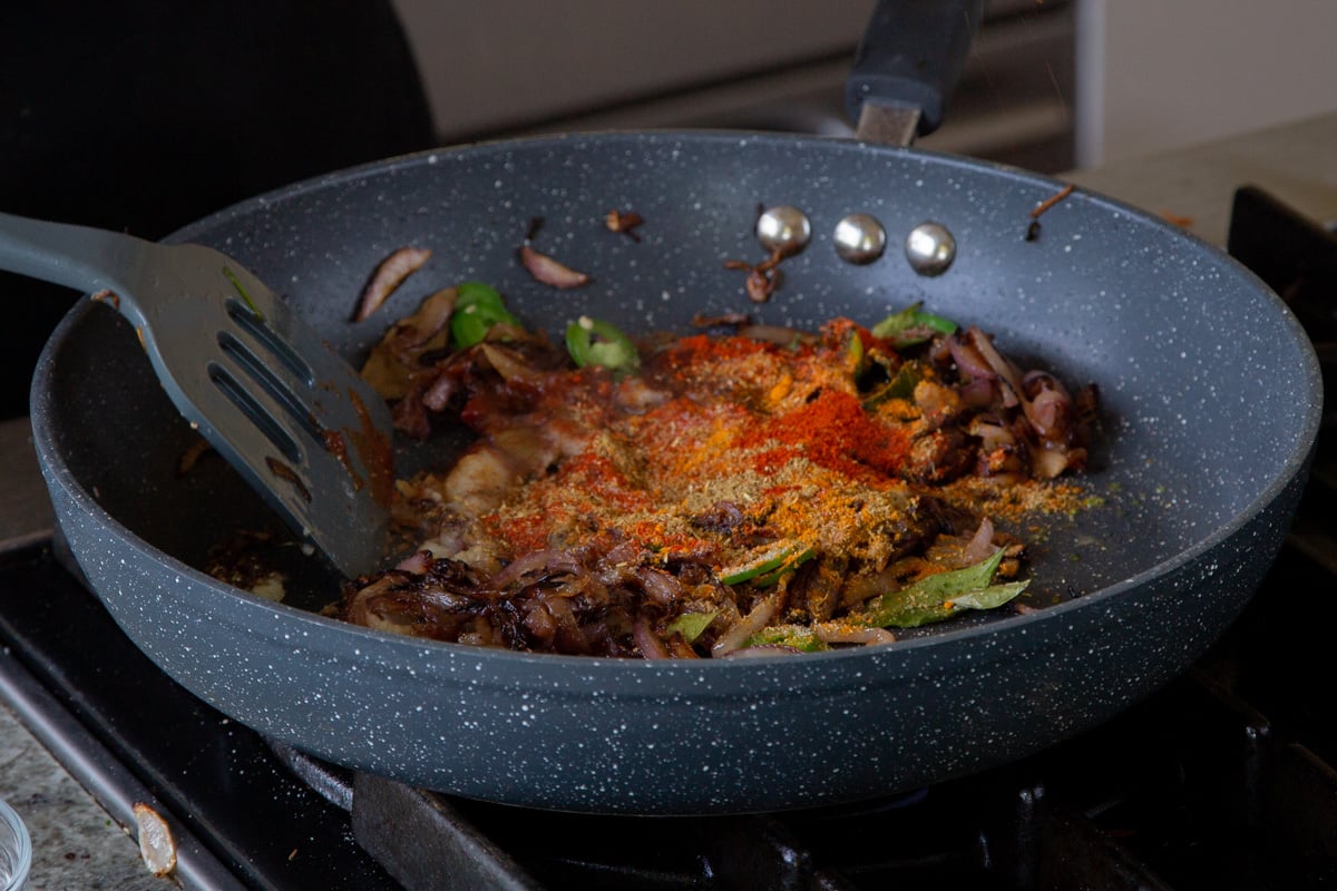 adding ground spices to the onion mixture