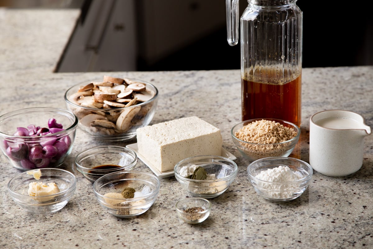 mushroom gravy and tofu schnitzel ingredients on a kitchen counter