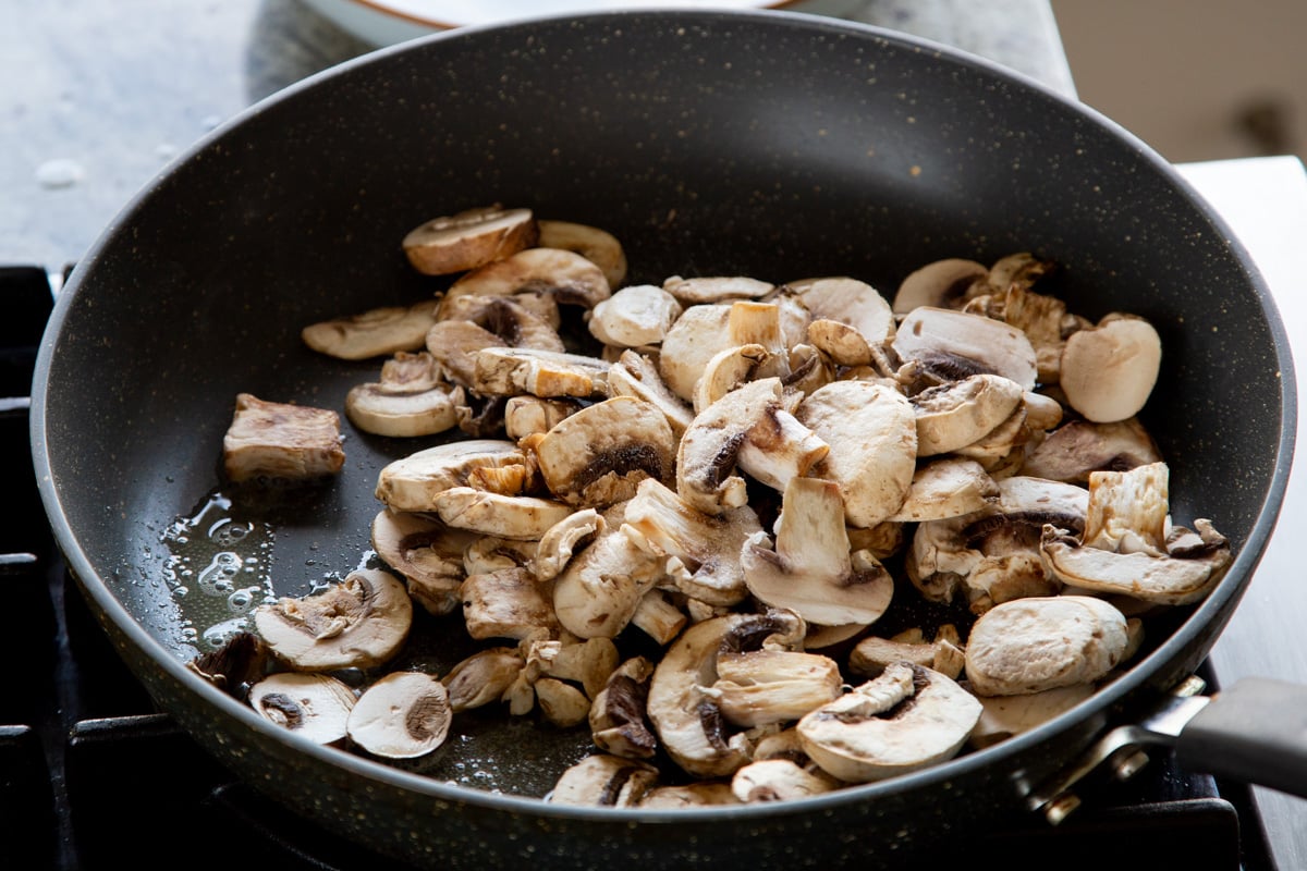 mushrooms in the frying pan before cooking