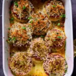 baked vegan caprese stacks in the baking dish, after baking