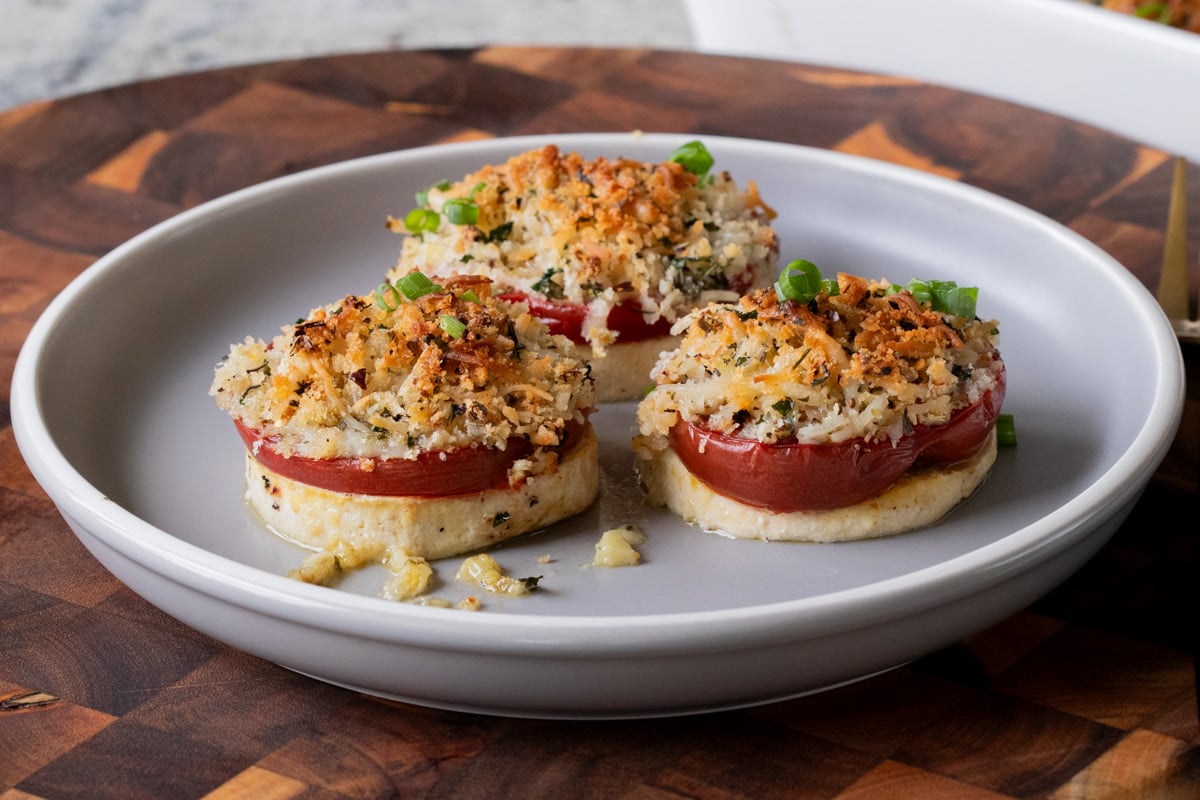 baked vegan caprese stacks on a plate
