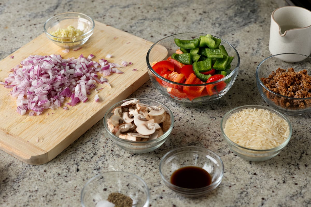 bell peppers, rice, and other casserole ingredients on the kitchen counter
