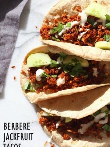 Berbere Spiced Jackfruit Tacos. Jackfruit and onion mixed with Berbere spice blend and baked to caramelized spiced perfection. Add some chickpeas to make into a hearty meal. Vegan Soy-free Nut-free Recipe, Can be Glutenfree | VeganRicha.com