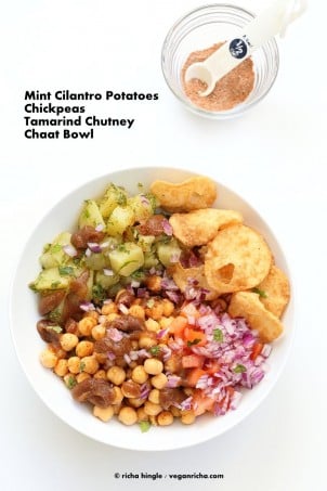 Chickpea Aloo Chaat Bowl. Mint cilantro Potatoes, spiced chickpeas, tamarind date chutney bowl with onions, tomatoes and chaat masala. | VeganRicha.com #vegan #glutenfree #bowl #recipe