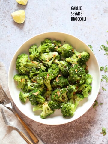 Sesame Garlic Broccoli needs just 6 ingredients. It is vibrant with blanched broccoli and delicious with a simple dressing of garlic roasted with sesame oil. A perfect side. #Vegan #glutenfree #soyfree #nutfree #veganricha #recipe 