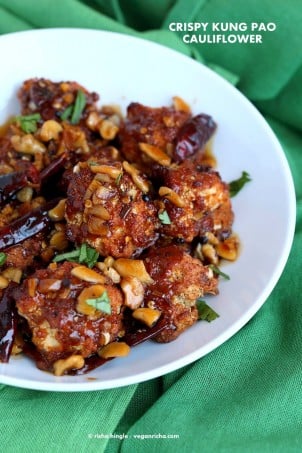 Crispy Kung Pao Cauliflower. Cauliflower battered and baked and tossed in spicy kung pao sauce. | VeganRicha.com #vegan #appetizer #snack #cauliflower #kungpao #recipe
