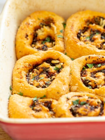 Vegan Pizza Rolls. Easy Pizza dough stuffed with herbed mushroom tomato filling, rolled, sliced and baked. Delicious snack or appetizer! #Vegan #Soyfree #Nutfree #Recipe #Veganpizzarolls #VeganRicha 