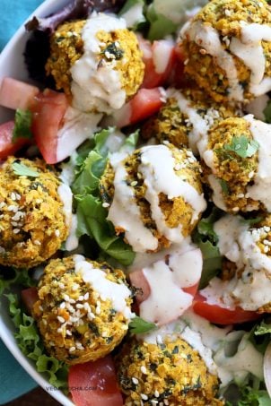 Turmeric Lentil Fritters Tomato Greens Bowl with Tahini Dill Sauce. Baked Seedy Golden Lentil fritters with greens, tomatoes and a tahini sauce make an easy Lunch bowl. Vegan Nut-free Soy-free Recipe. Easily Glutenfree | VeganRicha.com