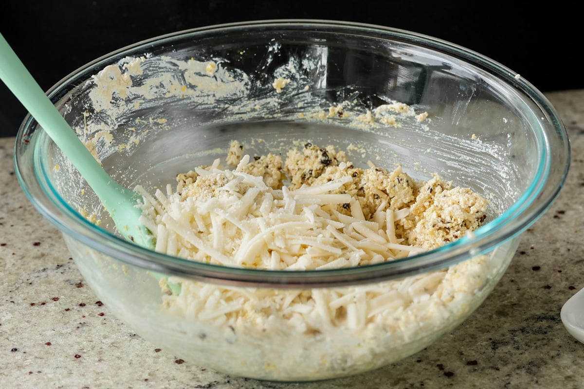 adding vegan cheese to the tofu mixture