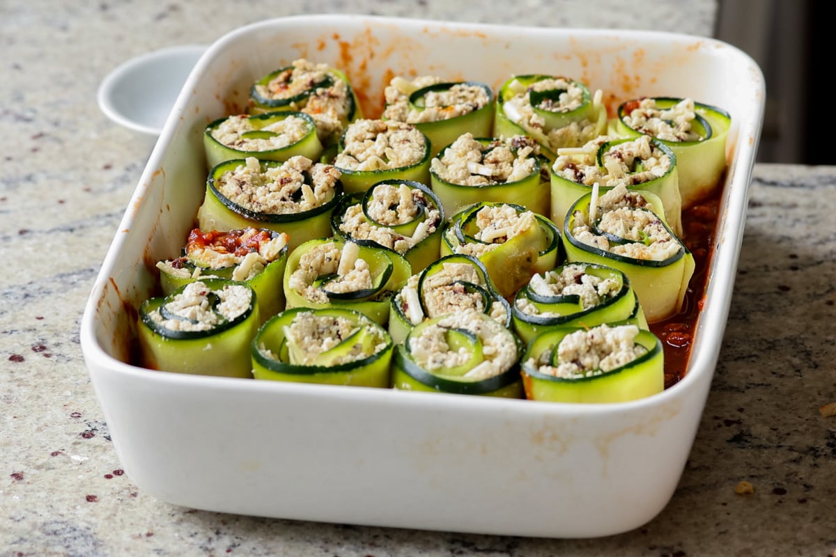 all of the zucchini rolls, arranged in the baking dish