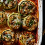 close-up of zucchini rolls in the baking dish after baking