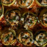 close-up of zucchini rolls in the baking dish after baking